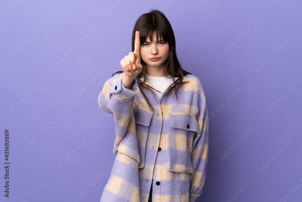 Young Ukrainian woman isolated on purple background counting one with serious expression Young Ukrainian woman isolated on purple background counting one with serious expression