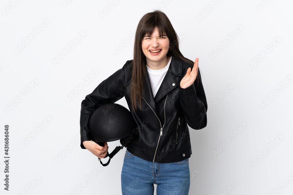 Woman holding a motorcycle helmet isolated on white background laughing Woman holding a motorcycle helmet isolated on white background laughing