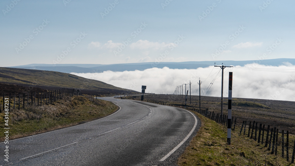 Temperature inversion in Cumbria causing fog to lie in the valley below Hartside, UK