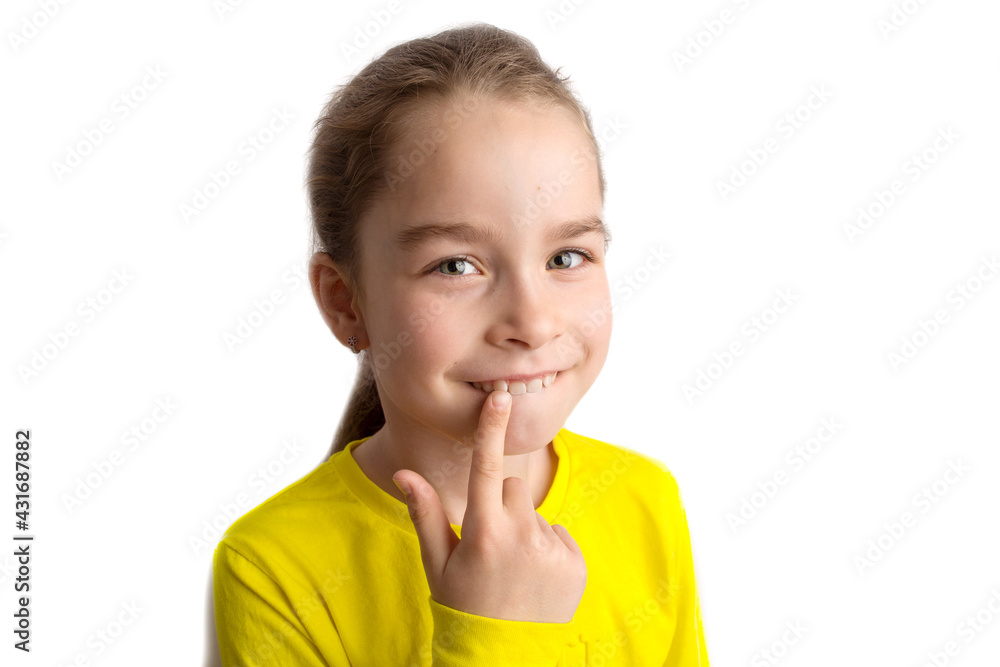 Little girl stands on a white background with a beautiful smile, children crooked teeth, pediatric dentistry. Crooked teeth close-up. Correction of malocclusion is required. Little girl stands on a white background with a beautiful smile, children crooked teeth, pediatric dentistry. Crooked teeth close-up. Correction of malocclusion is required.