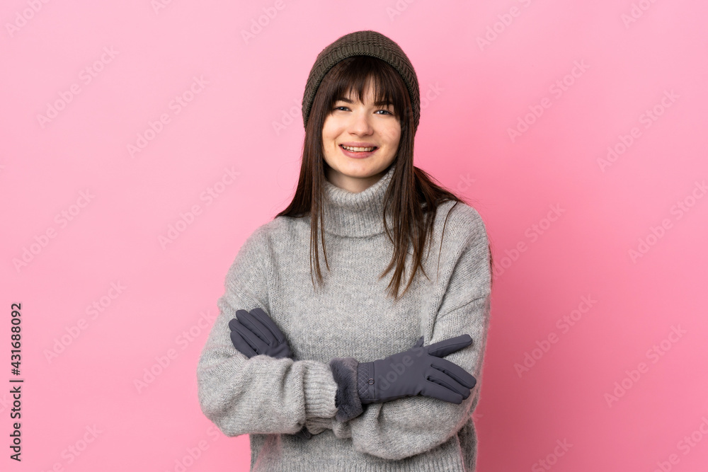 Teenager Ukrainian girl with winter hat isolated on white background laughing Teenager Ukrainian girl with winter hat isolated on white background laughing