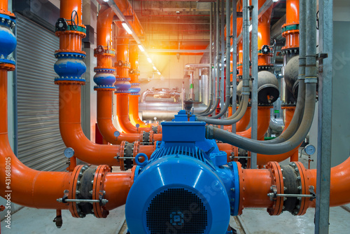 pipes and valves.Industrial water condenser pump and  HVAC  air conditioning system and pipping line of industrial construction at Chiller plant  room system in the factory.