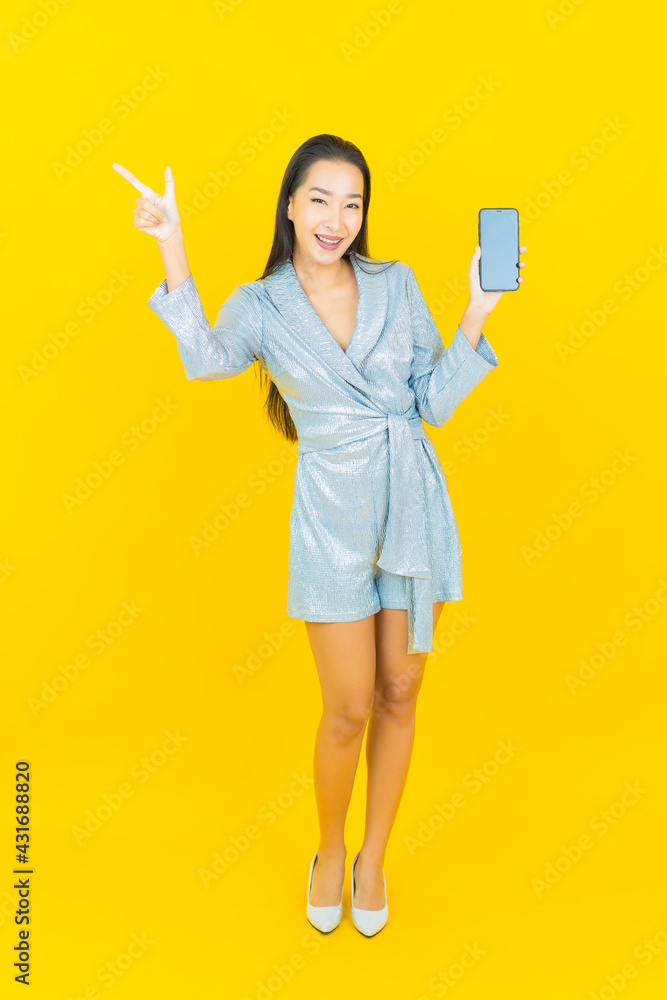Portrait beautiful young asian woman smile with smart mobile phone Portrait beautiful young asian woman smile with smart mobile phone