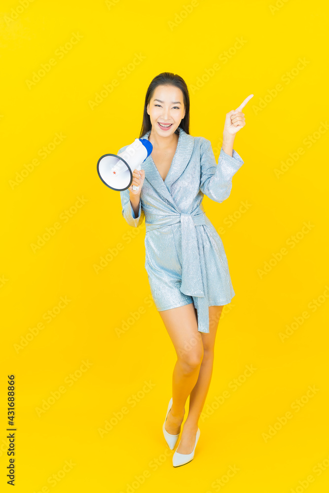 Portrait beautiful young asian woman smile with megaphone Portrait beautiful young asian woman smile with megaphone