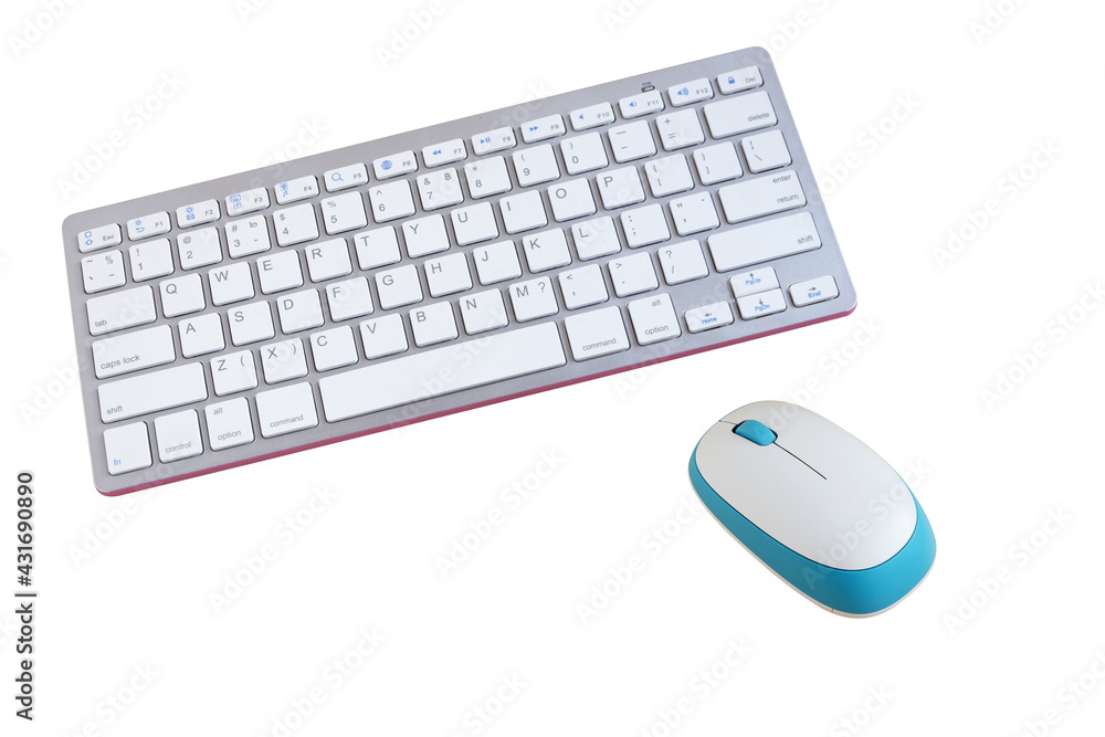 White wireless keyboard and mouse isolated on wooden background White wireless keyboard and mouse isolated on wooden background