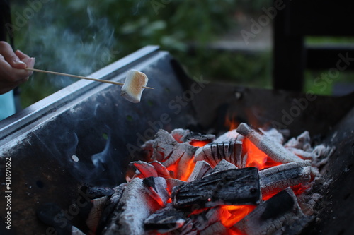 Burning charcoal and roasted marshmallows