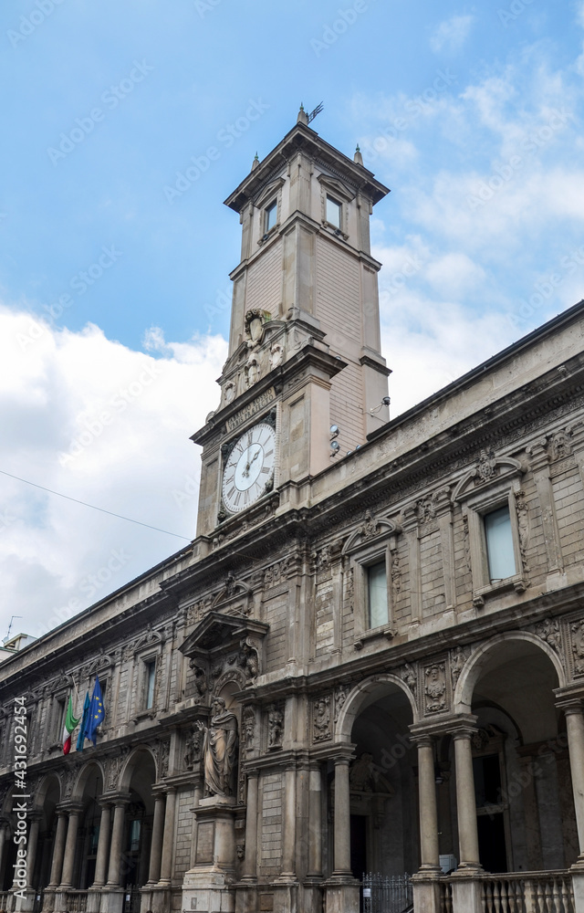 The Giureconsulti palace congress center of Chamber of Commerce with clock tower on Mercanti square near Duomo square in Milan city center, Italy