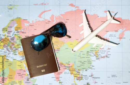 travel concept with plan money passport  sunglasses photo
