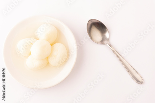 Rasgulla, Rasagola or Roshogolla is a South Asian syrupy dessert popular in the Indian subcontinent and regions with South Asian diaspora. It is made from ball-shaped dumplings of chhana and semolina  photo