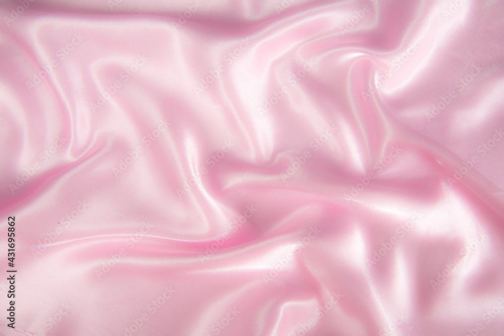 Abstract pink silk fabric texture background. Cloth soft wave. Creases of satin Abstract pink silk fabric texture background. Cloth soft wave. Creases of satin