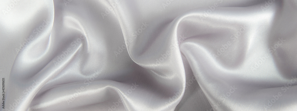 Obraz premium Abstract gray silk fabric texture background. Cloth soft wave. Creases of satin