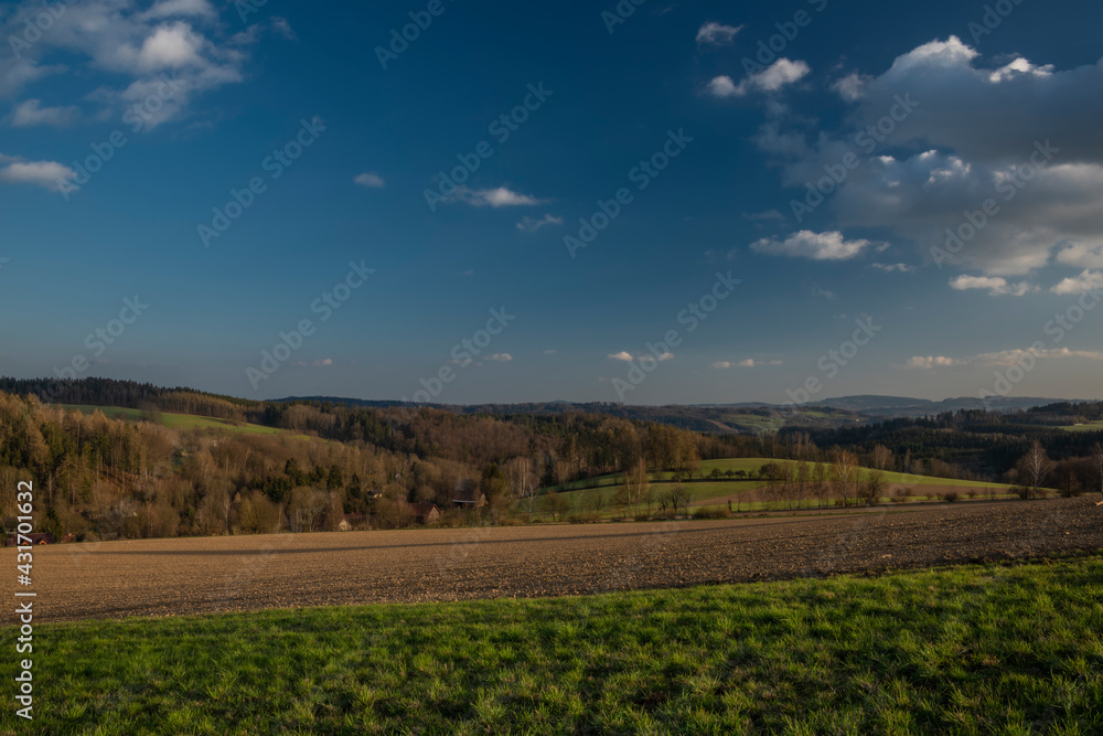 Obraz premium View for Roprachtice village with old church in spring nice sunny evening