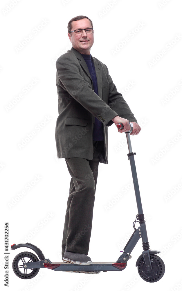 in full growth. Mature man with an electric scooter. in full growth. Mature man with an electric scooter.
