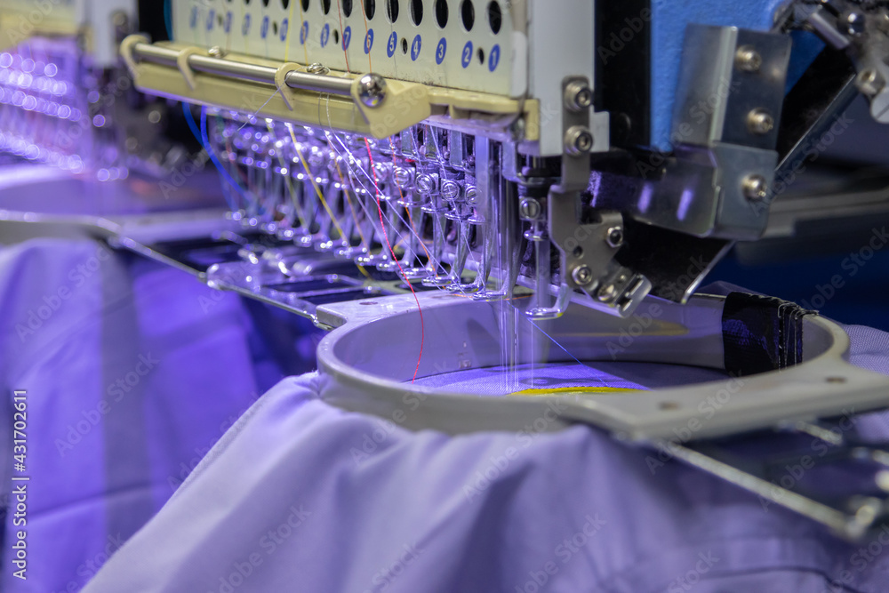Embroidery machine in progress embroidery company logo Embroidery machine in progress embroidery company logo