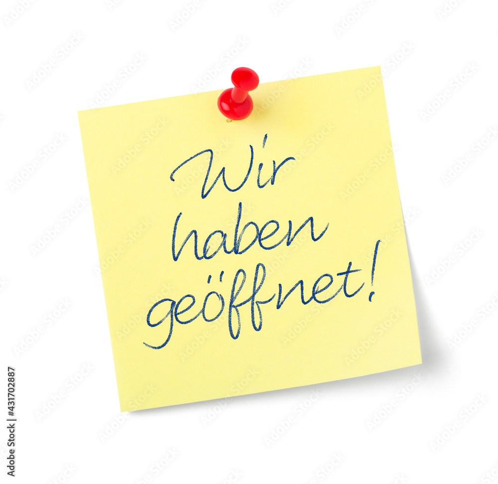 Yellow paper note with text We are open in german - Wir haben geöffnet Yellow paper note with text We are open in german - Wir haben geöffnet