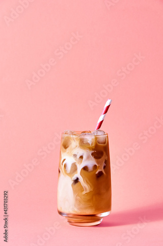 Iced Coffee with Milk in Tall Glasses on Pink Background. Concept Refreshing Summer Drink