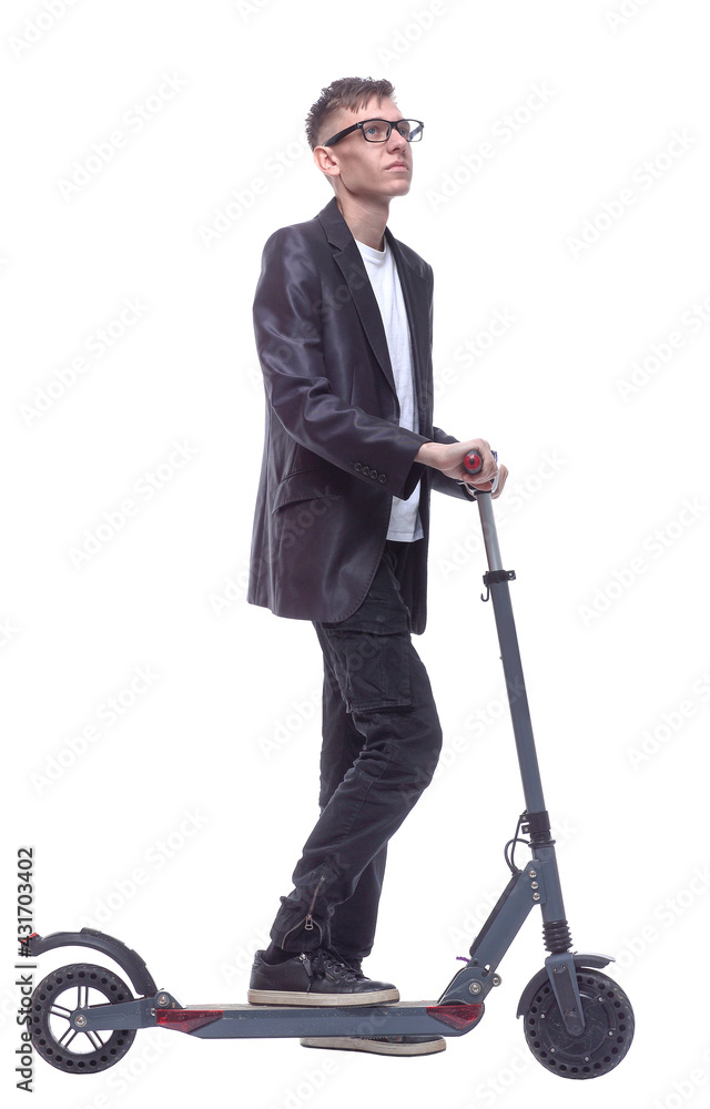 side view. student guy with an electric scooter looking at you. side view. student guy with an electric scooter looking at you.