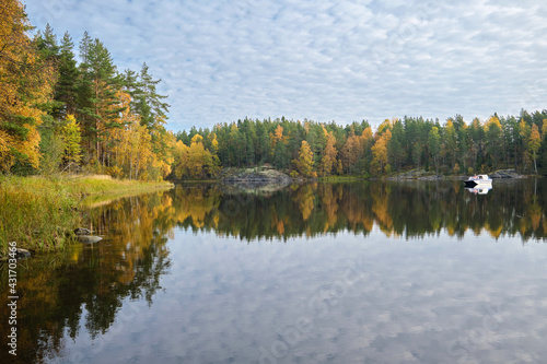 Russia, Republic of Karelia, natural attractions - Ladoga skerries on the lake, bright autumn forest.