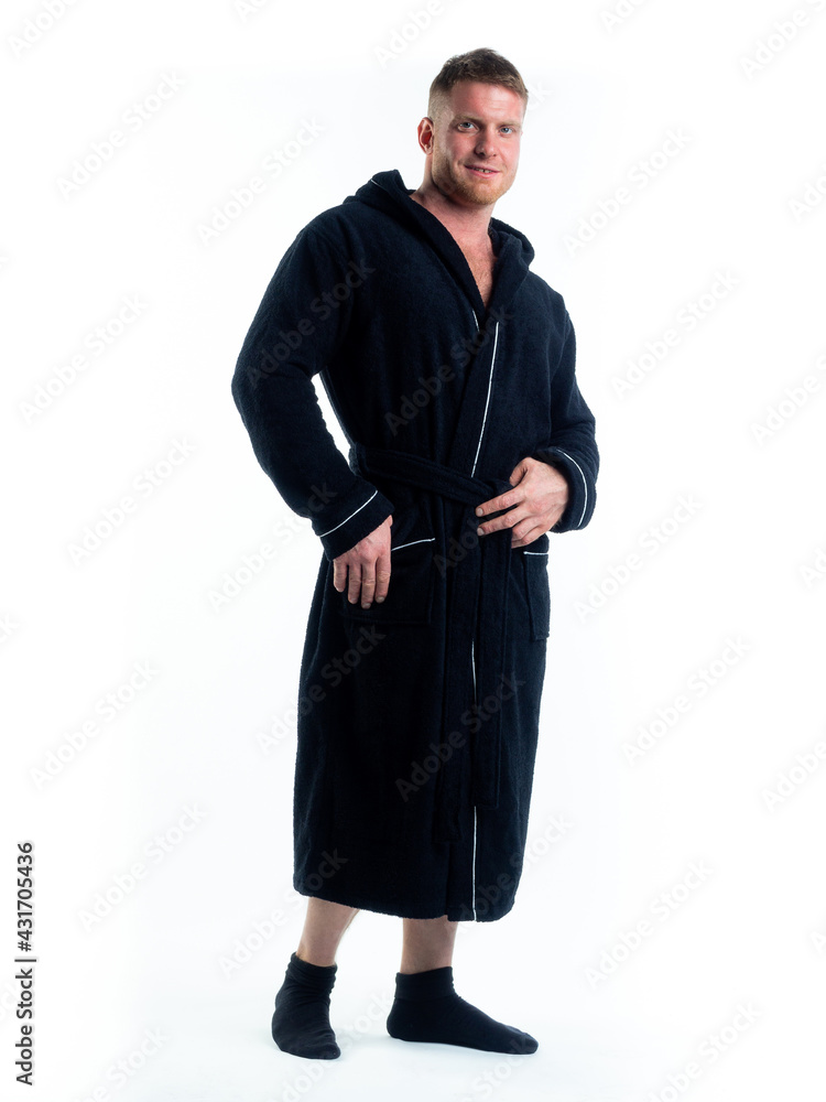 strong man in a Bathrobe on an isolated white background with a smile on his face. strong man in a Bathrobe on an isolated white background with a smile on his face.