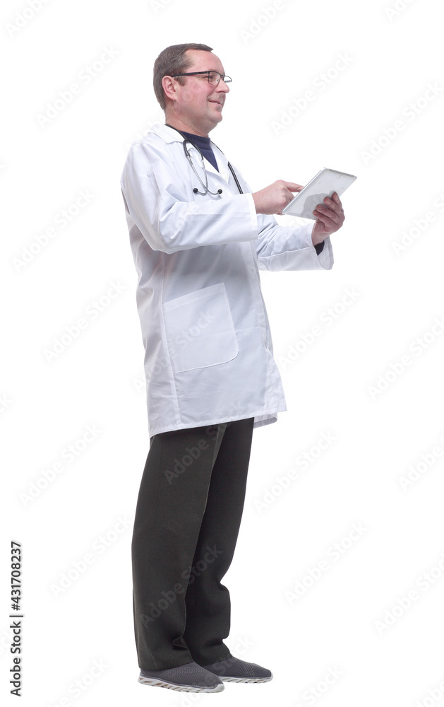 side view. doctor with a stethoscope using a digital tablet. side view. doctor with a stethoscope using a digital tablet.