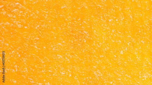 Bright orange texture of mango jerky slice