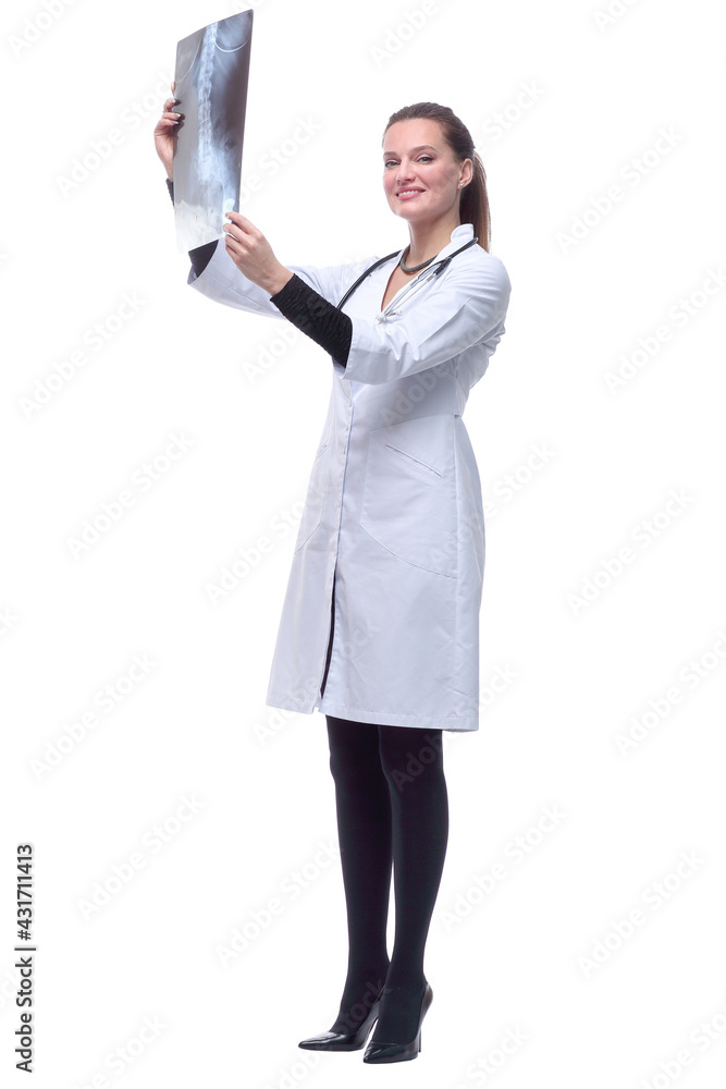 in full growth. smiling female doctor showing an x-ray. in full growth. smiling female doctor showing an x-ray.