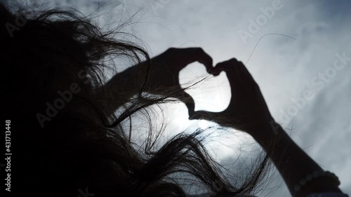 hands in shape of love heart