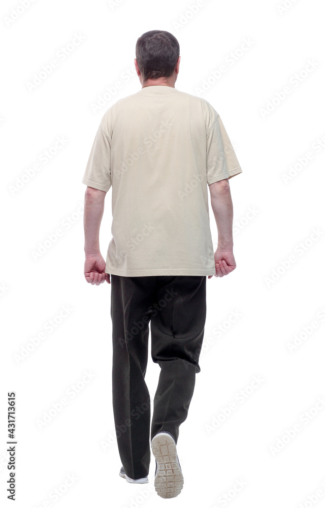in full growth. a man in a light t-shirt striding forward. in full growth. a man in a light t-shirt striding forward.