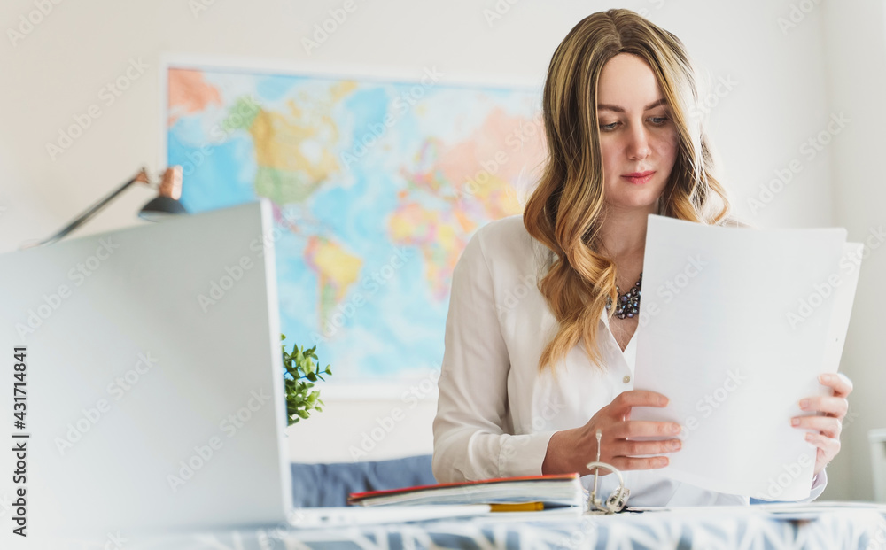 Travel agent working with documents at office. Travel agent working with documents at office.