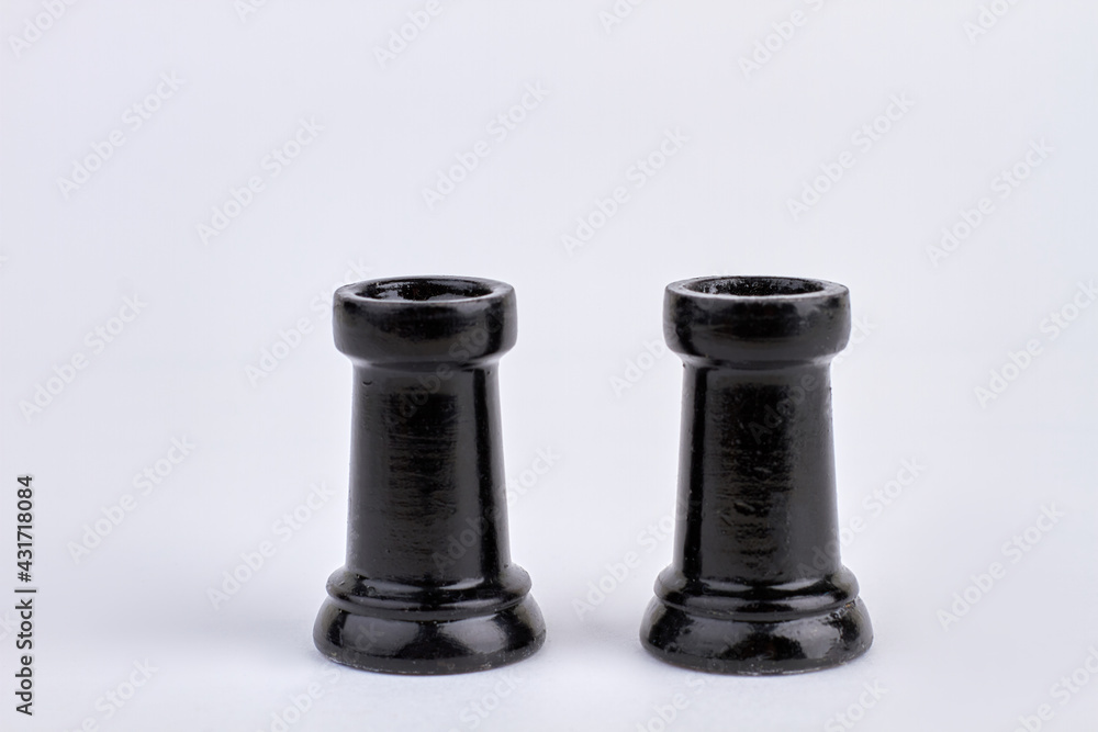 Two rook chess pieces against white background. Two rook chess pieces against white background.