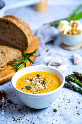 Pumpkin soup with vegetables and bread