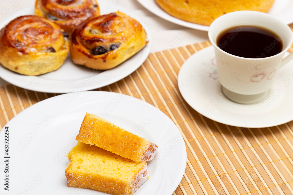 Coffee table with orange cake, apple donut and sugar. Top View. Coffee table with orange cake, apple donut and sugar. Top View.