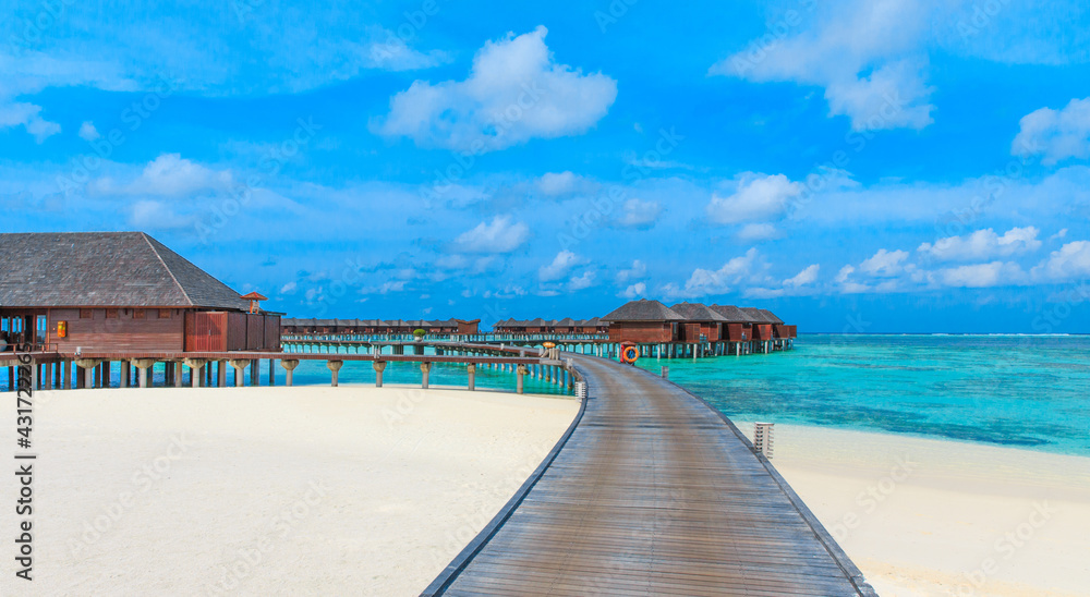  beach with water bungalows at Maldives.