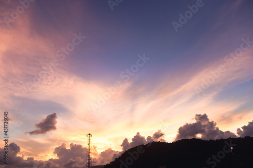 Landscape view with eveing cloudy sky  have electric pole near mountain.