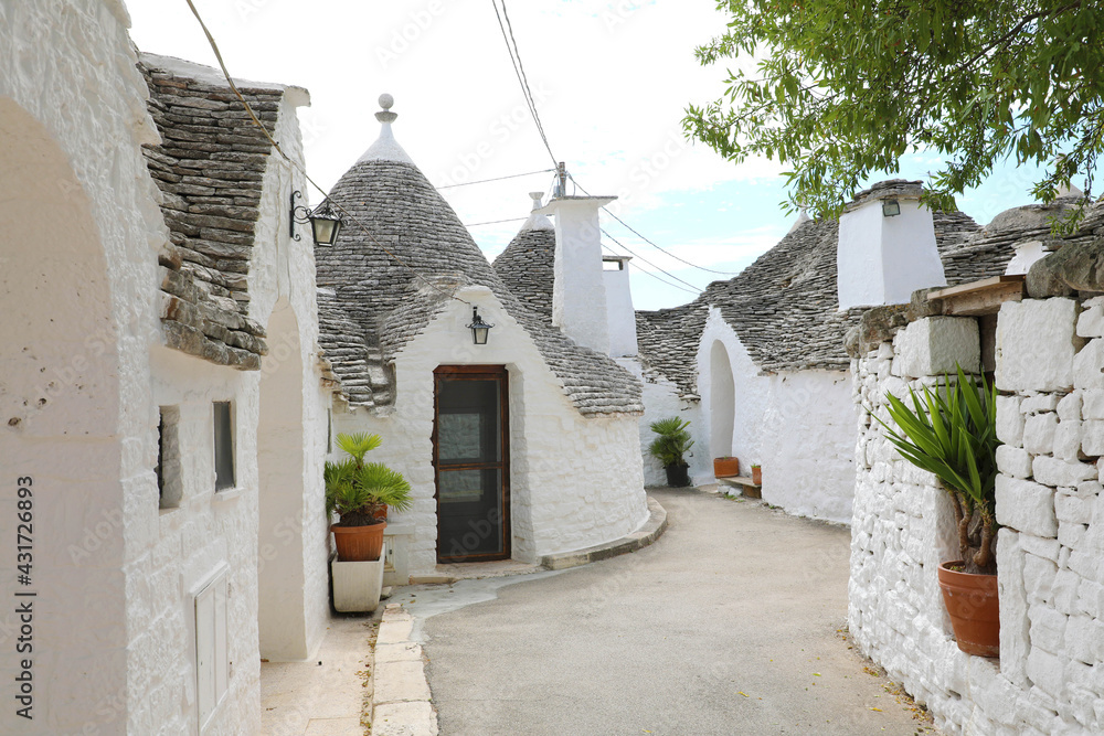 Alberobello village with traditional dry stone hut with a conical roof in Apulia, Italy