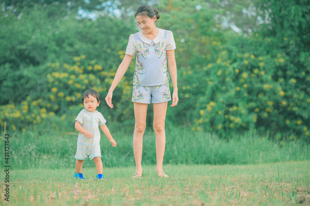 Mother And Baby outdoors. Nature.Portrait of happy loving mother Mother And Baby outdoors. Nature.Portrait of happy loving mother