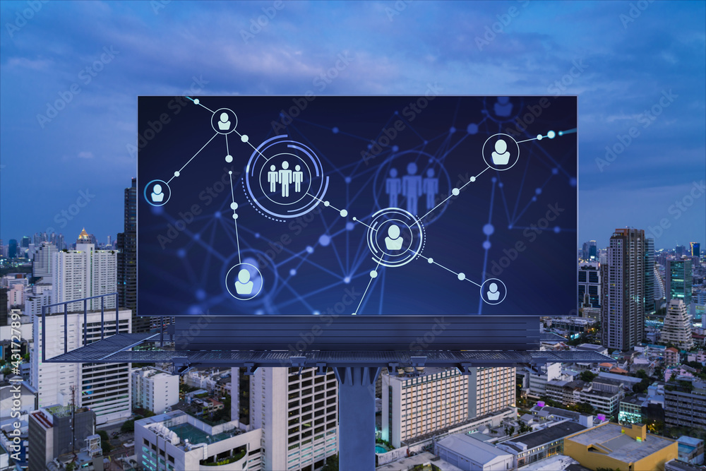 Fototapeta premium Glowing Social media icons on billboard over night panoramic city view of Bangkok. The concept of networking and establishing new connections between people and businesses in Southeast Asia