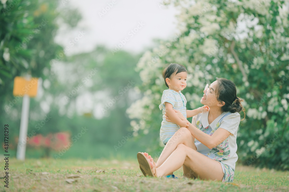 Fototapeta premium Mother And Baby outdoors. Nature.Portrait of happy loving mother