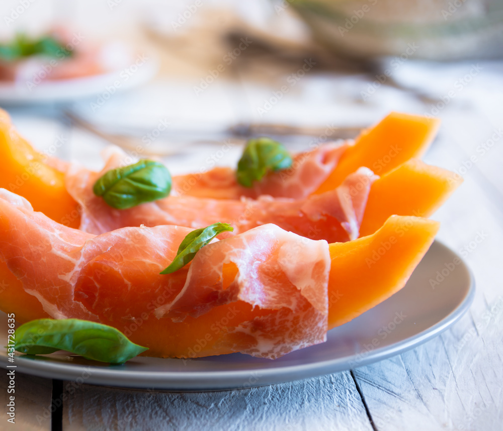 Fresh sweet melon with prosciutto ham, healthy summer food Fresh sweet melon with prosciutto ham, healthy summer food