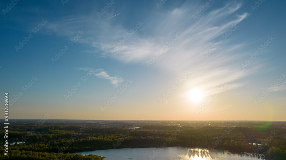Obraz premium Stunning aerial drone landscape image of sunset or sunrise in spring over Europese countryside. High quality photo