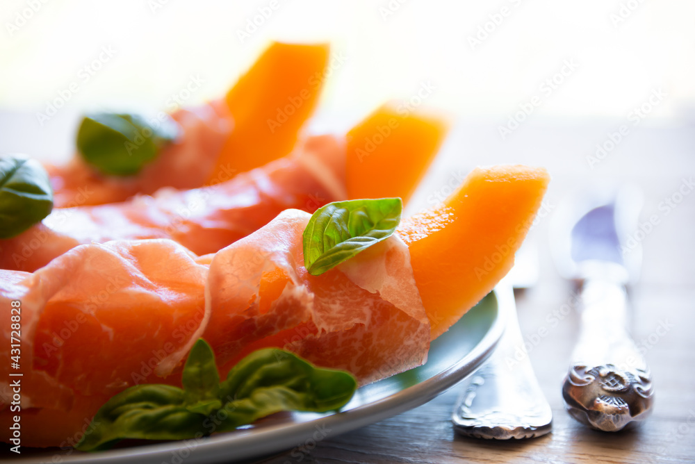 Fresh sweet melon with prosciutto ham, healthy summer food Fresh sweet melon with prosciutto ham, healthy summer food