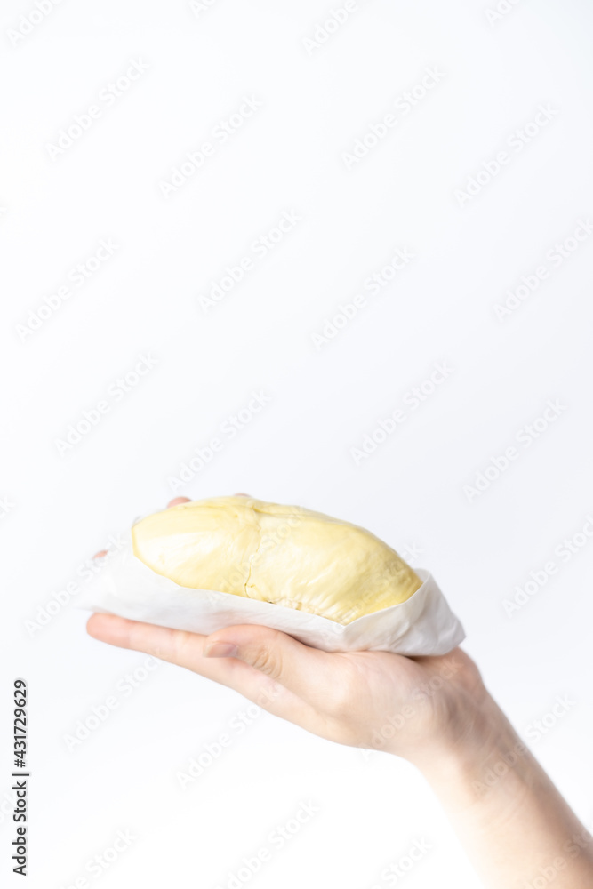 Farmer hand holding Ripe durian the king of tropical fruits on white background. Farmer hand holding Ripe durian the king of tropical fruits on white background.
