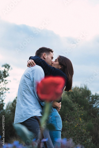 silhouette of a couple with a rose