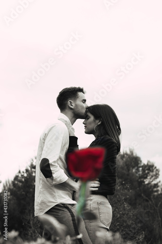 silhouette of a couple with a rose