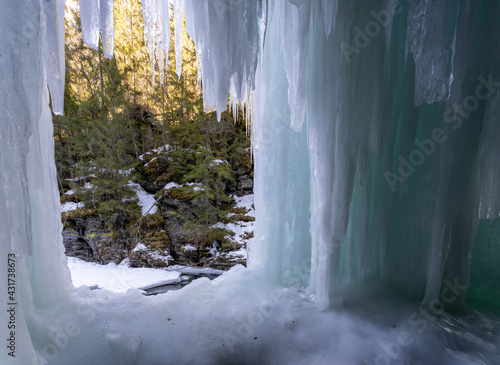 Ice cave called Iskjørkja on the Tromsaelva River, near the village of Fåvang, Norway photo