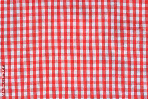 Picnic table cloth. Seamless checkered pattern. Vintage red plaid fabric texture. 