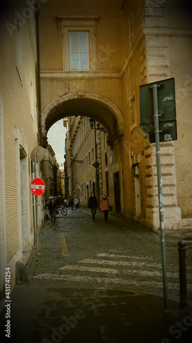 View of the Forum of Rome through an arch between two apartment buildings on the Campidoglio square in Rome