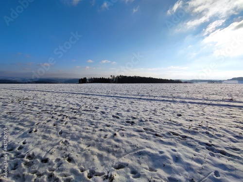 View over snow covered field on a sunny winters day