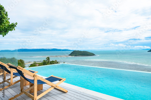 photo of ocean view and blue sky from a poolside