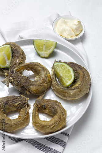 Typical Spanish frying of fried fish with lemon